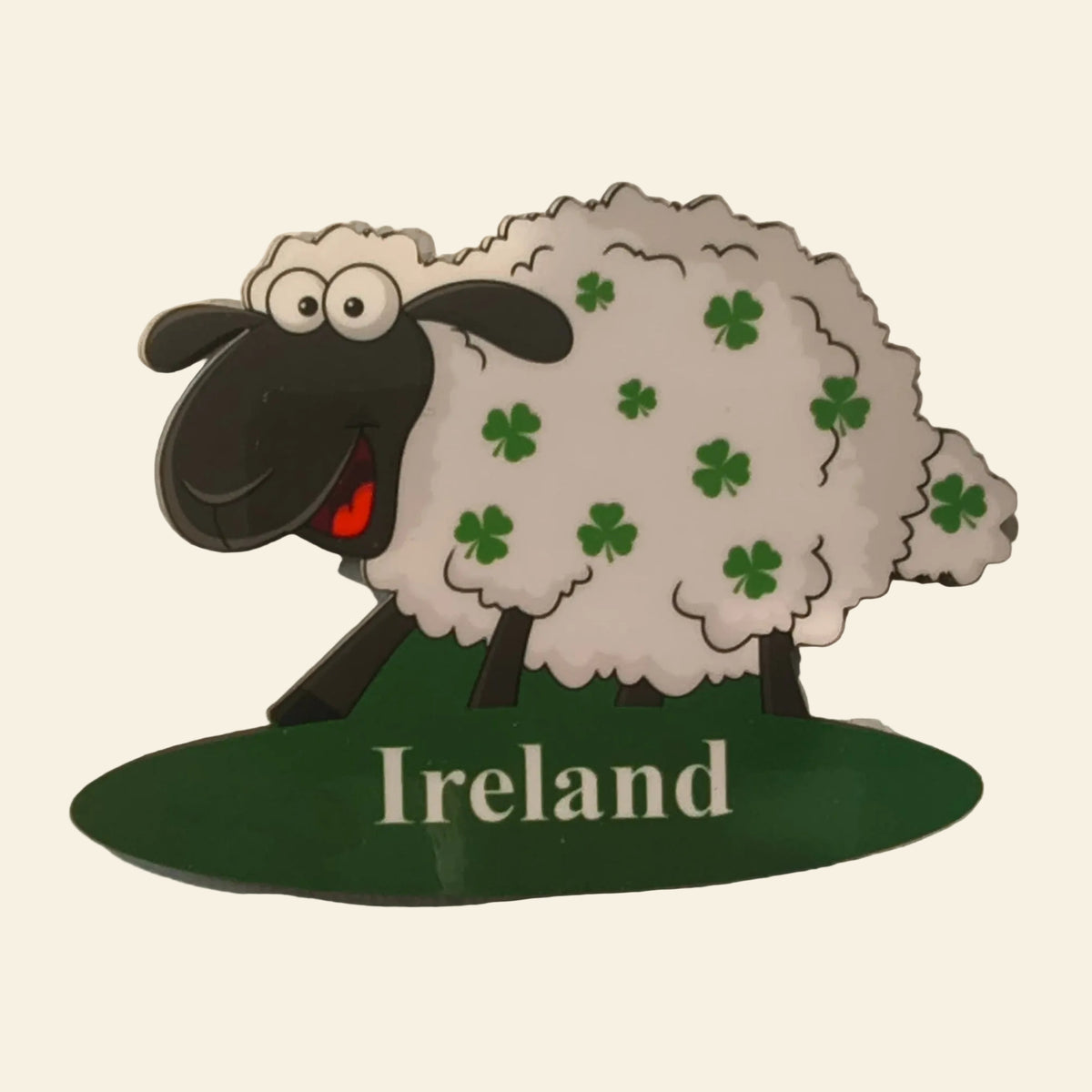 Fridge magnet of a white sheep covered in green shamrocks on a green Ireland oval