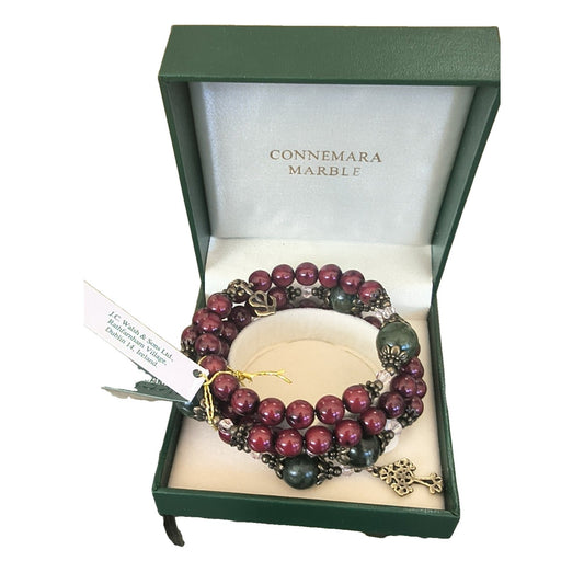 Red and Connemara marble wrap bracelet with Celtic cross and Claddagh charms in Connemara Marble gift box
