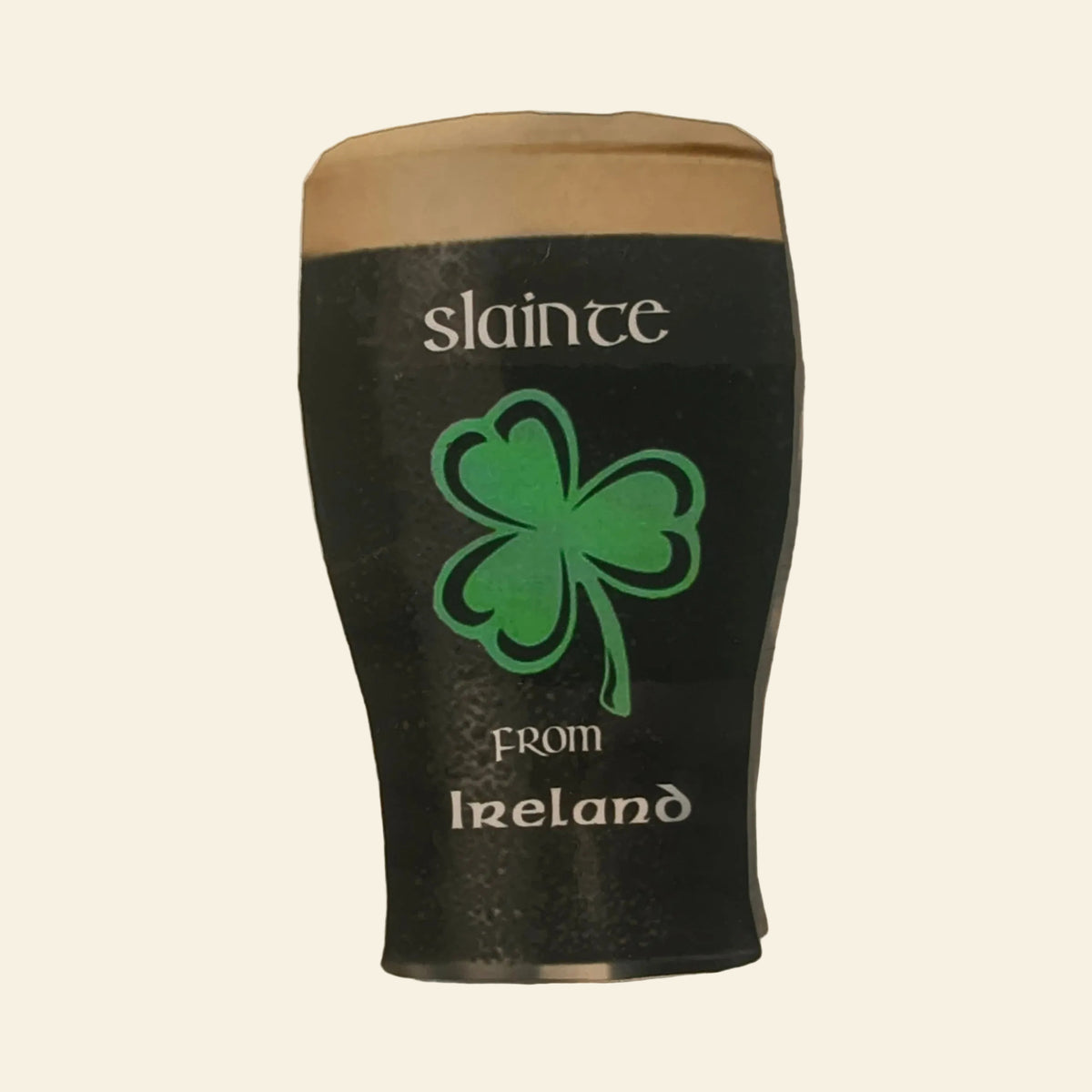 Fridge magnet shaped like a pint of stout with a green shamrock and the words Sláinte from Ireland